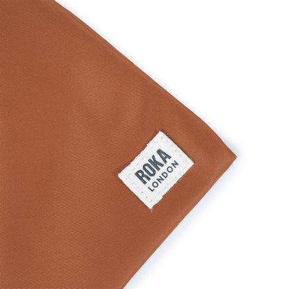 Chelsea Pocket Sling Bag Small in Bran