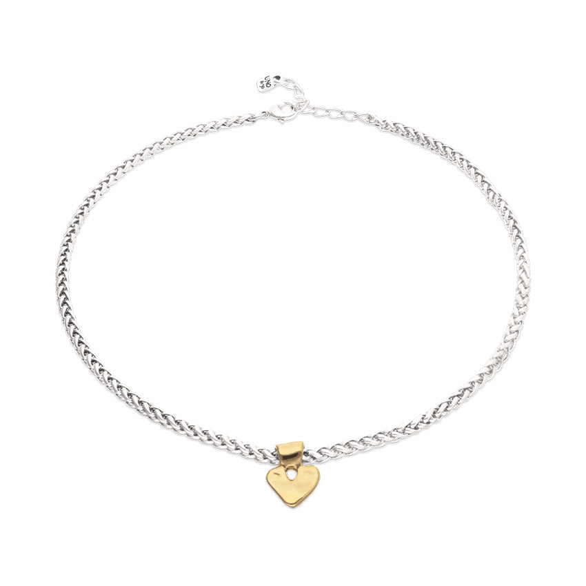 Short chain necklace with small gold heart detail